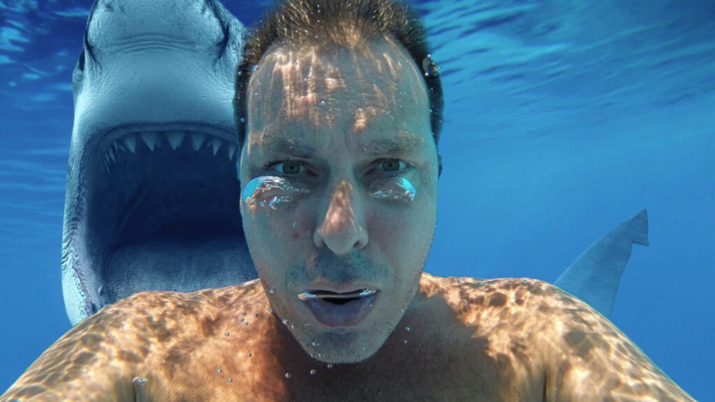 image showing a man about to learn how to survive a shark attack